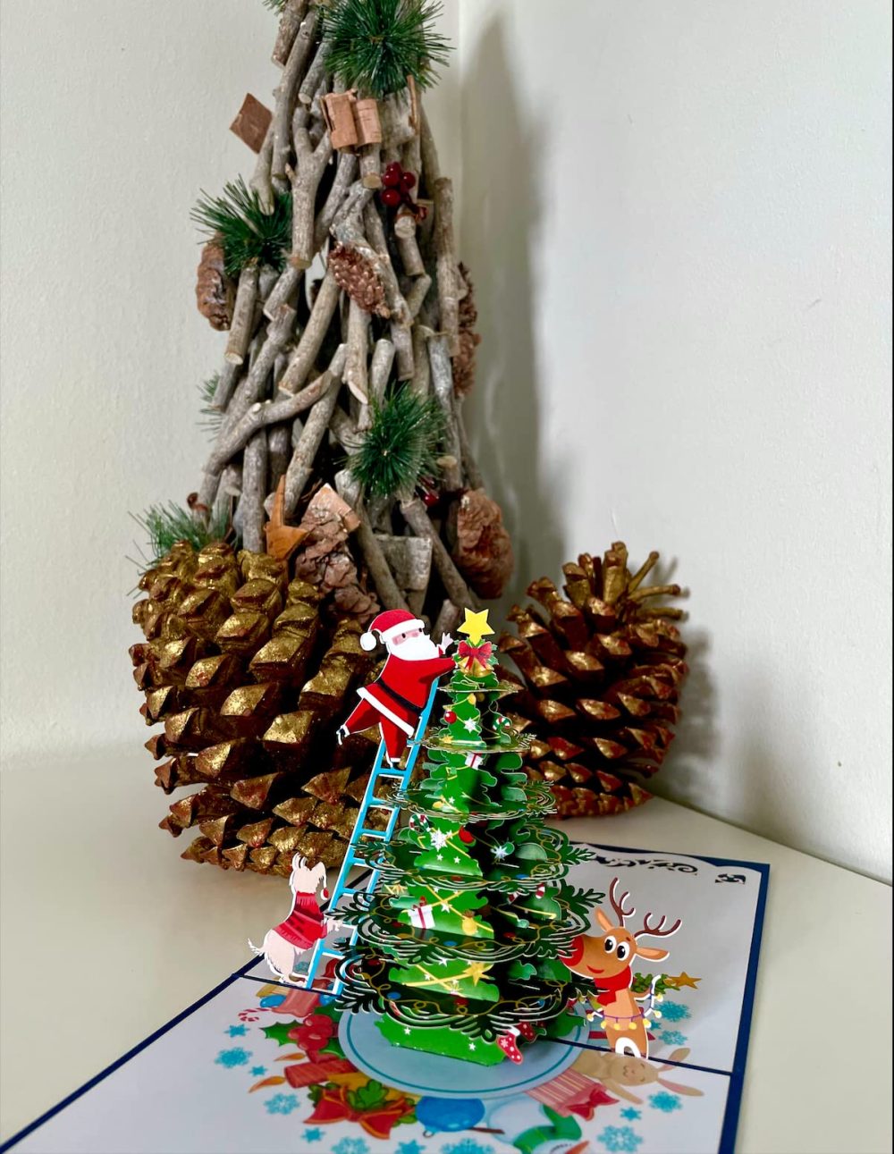 Santa Claus decorating Christmas Tree 3D Pop Up card.A Delightful holiday surprise greeting card gift for kids, friends, family and loved ones. For Christmas decor and parties.15cmx15cm - Image 3